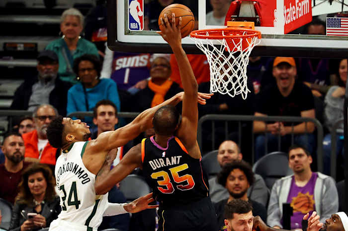 Phoenix Suns forward Kevin Durant (35) shoots the ball against Milwaukee Bucks forward Giannis Antetokounmpo (34)